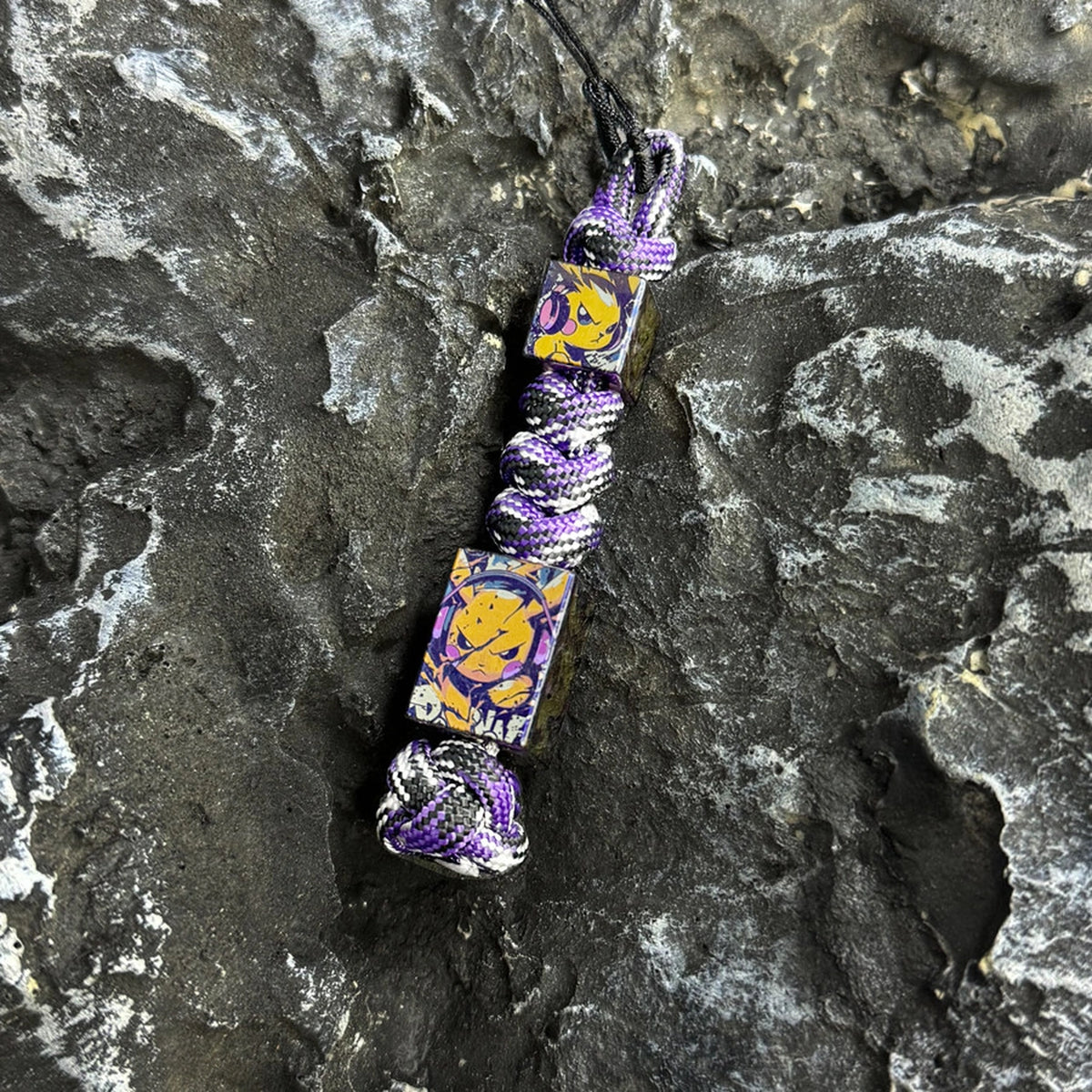 Lightning Pikachu Titanium Lanyard Beads: two character beads on purple woven lanyard (gallery view 02).