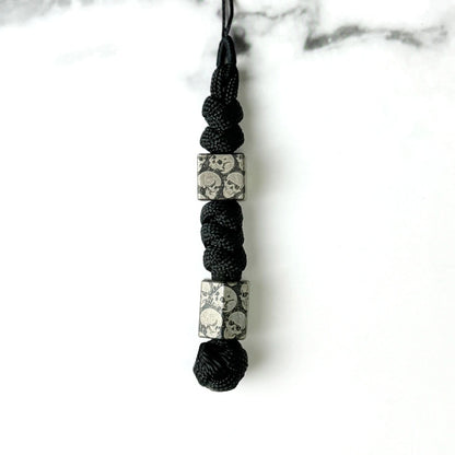 Dark Skull Titanium Lanyard Beads: two square skull beads on black cord (gallery view 17).