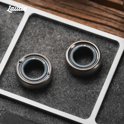 Titanium ratchet fidget ring shown on a finger