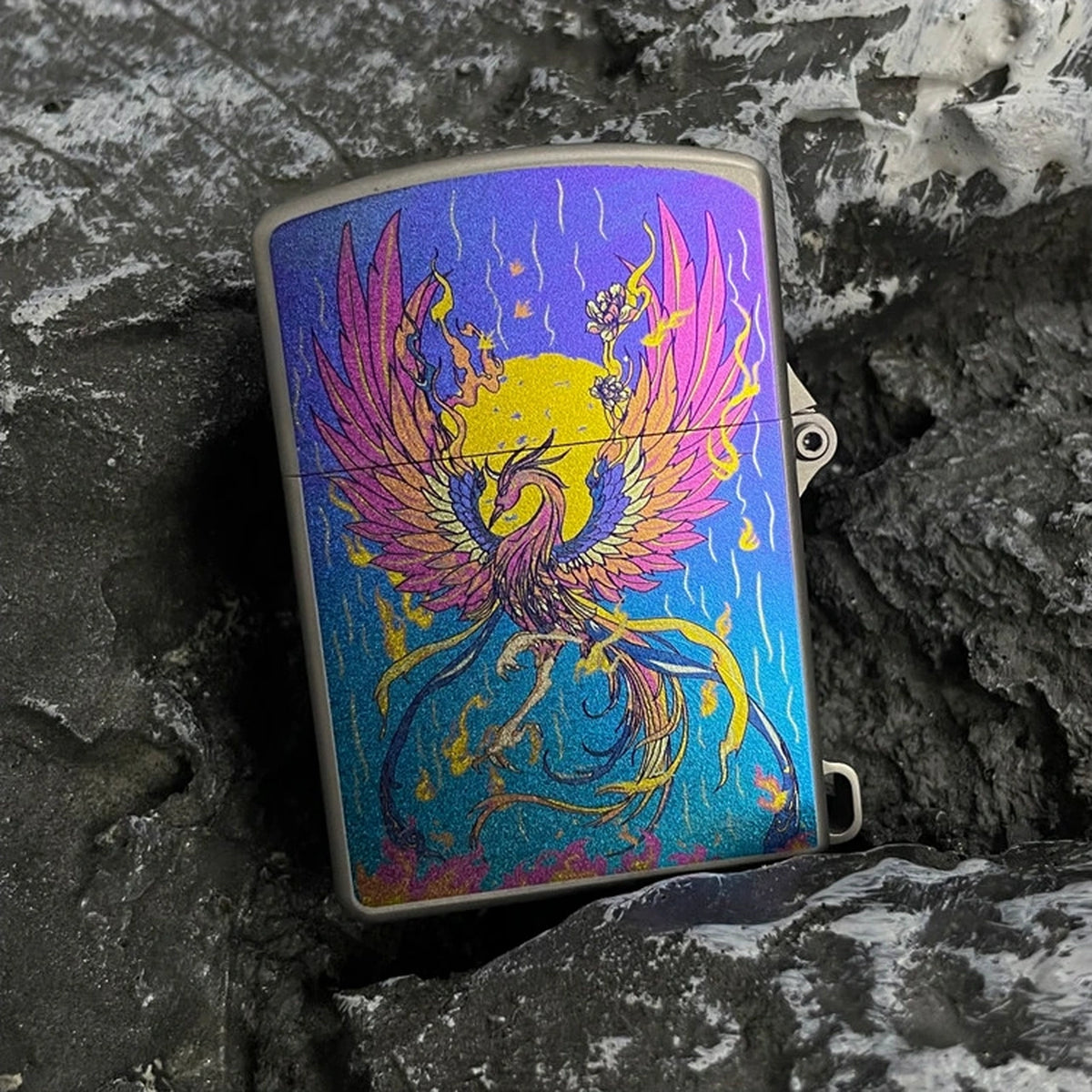 Titanium Wick Lighter: bird artwork face resting on stone (gallery view 03).