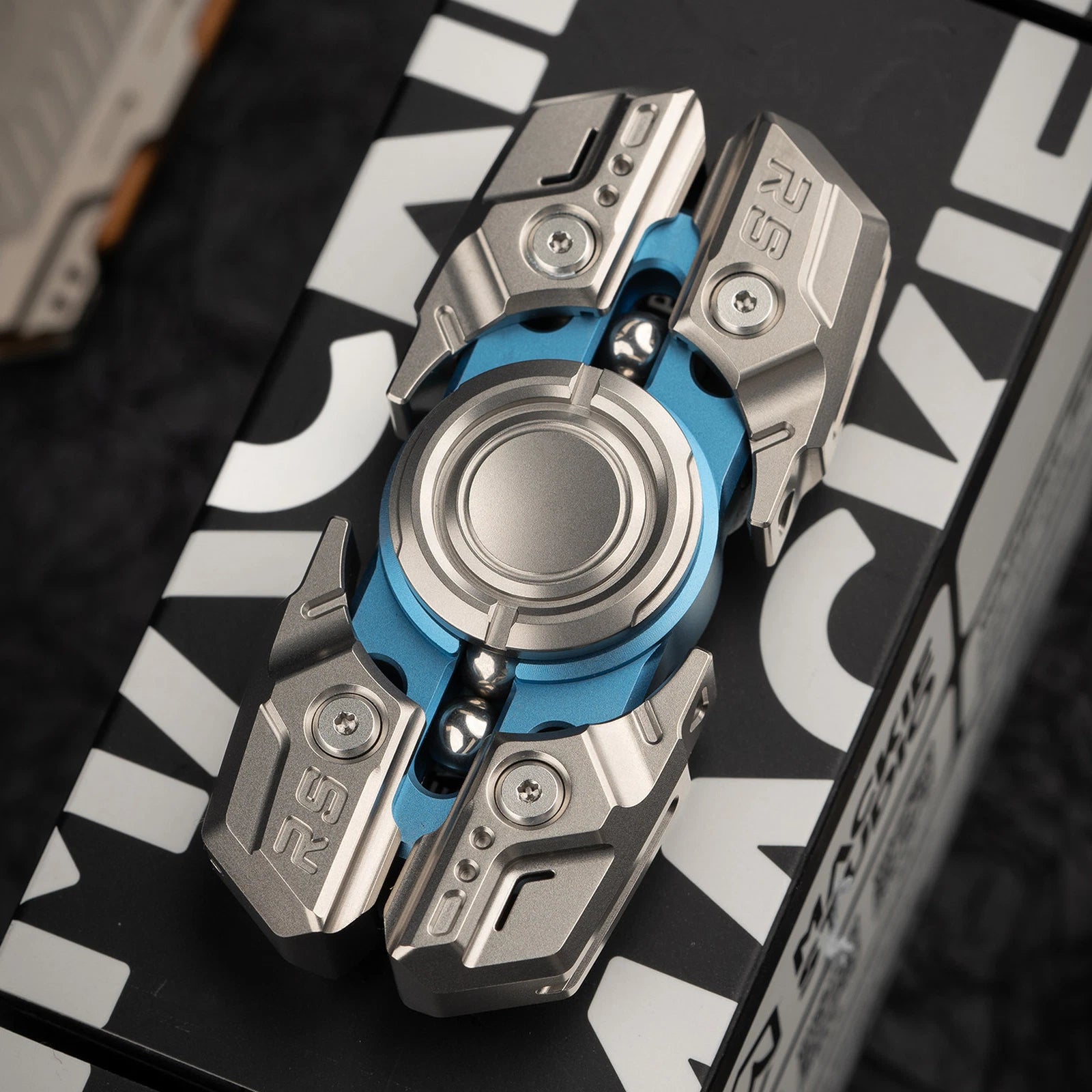 Blue and silver MACKIE Starship 2.0 fidget spinner with presentation box