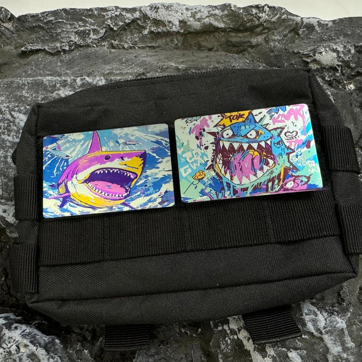 Illustrated Titanium Morale Patch: two shark patches displayed on a black patch panel (gallery view 03).