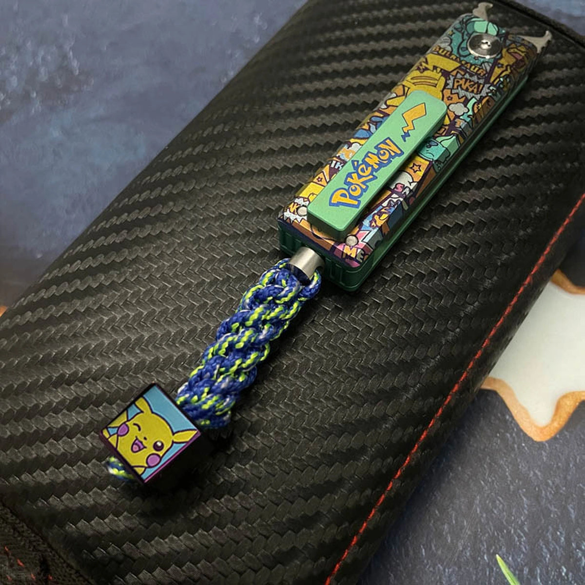 Black Paracord Lanyard Braiding Service: blue green cord fitted to a tool display example (gallery view 03).