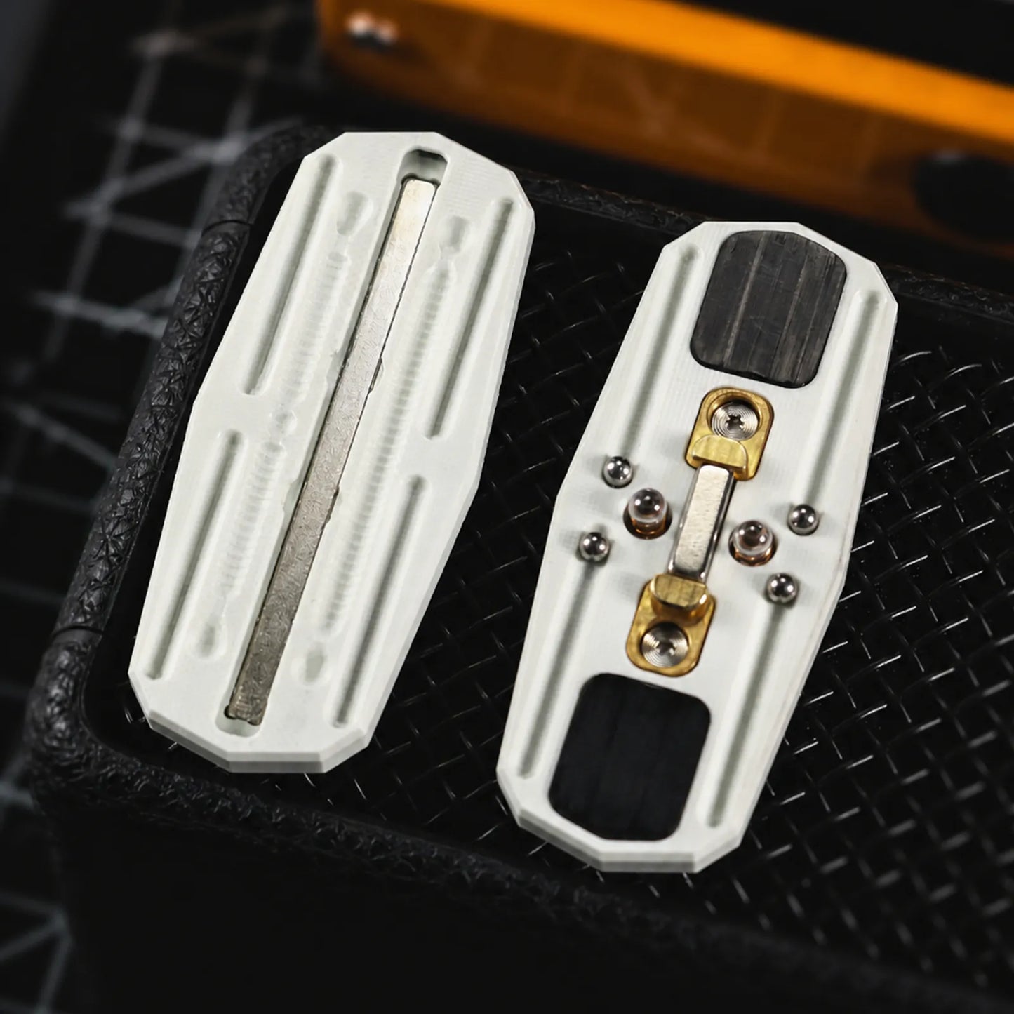 PEEK fidget slider opened to show its dual track internal structure