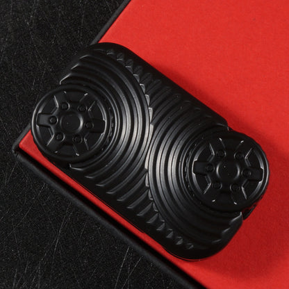 Black Star Wheel slider with two wheel-like face details and surrounding curved grooves.