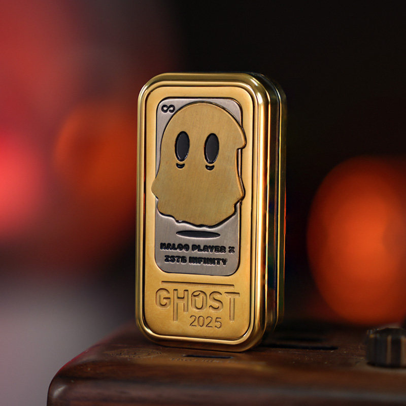 Gold-tone Ghost 2025 slider with a raised ghost illustration