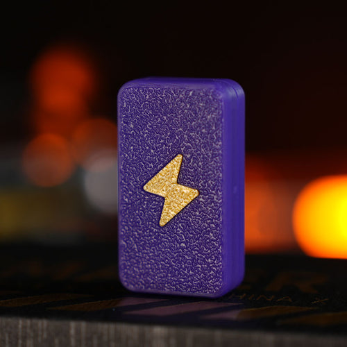 Twin-Track rectangular fidget slider in thermochromic / gold bolt with a textured lightning-bolt face.