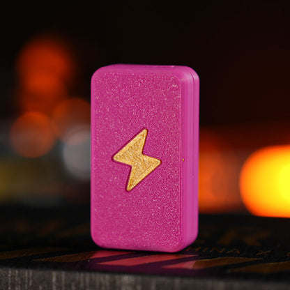 Twin-Track rectangular fidget slider in hot pink / gold bolt with a textured lightning-bolt face.