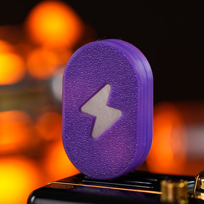 Aurora 2.0 / Thermochromic Purple fidget slider with a textured pill-shaped face and a lightning-bolt motif.