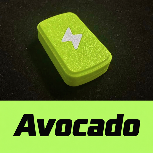 Avocado-colored Candy slider with a white lightning motif and a textured face on a dark surface; the image includes its Chinese color label.