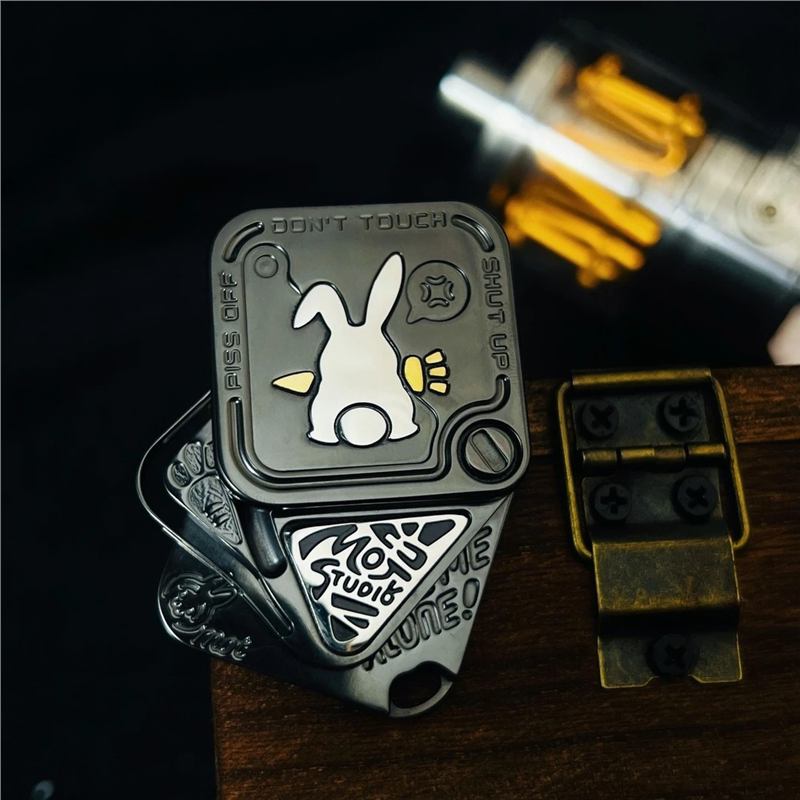Black stainless steel SNAP rabbit toy with offset square plates and MOT Studio inset
