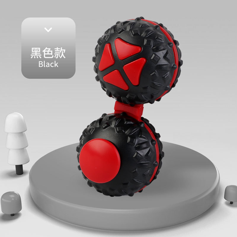 Black connected dual-ball fidget toy with red controls and raised surface texture.