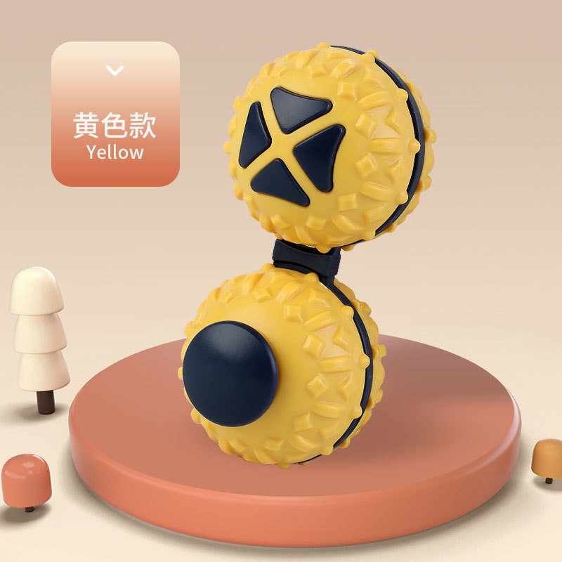 Yellow connected dual-ball fidget toy with dark controls and raised textured shells.