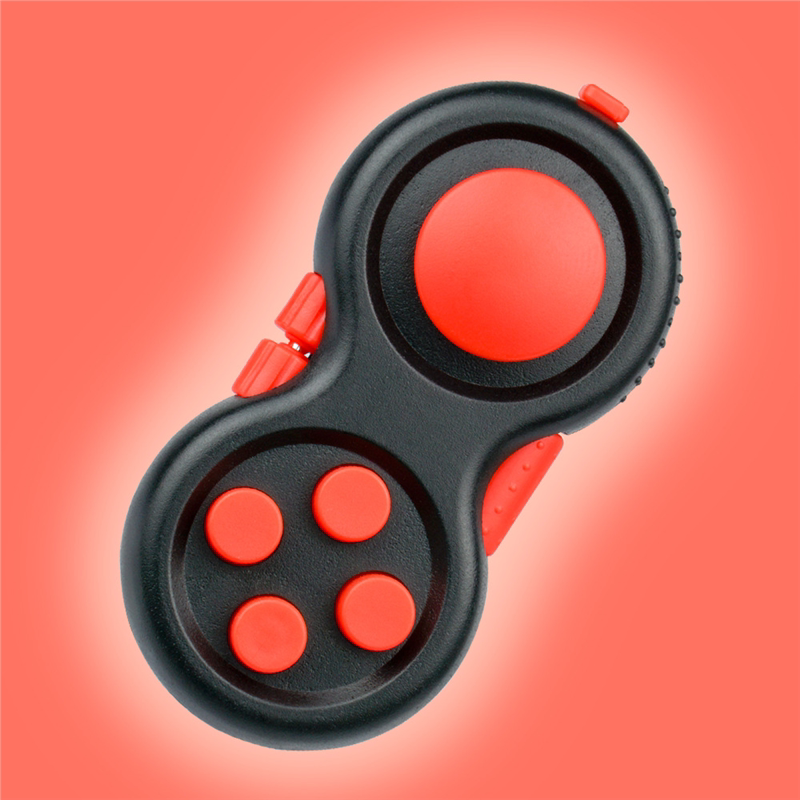 Black mini controller fidget with red buttons, joystick and edge controls.