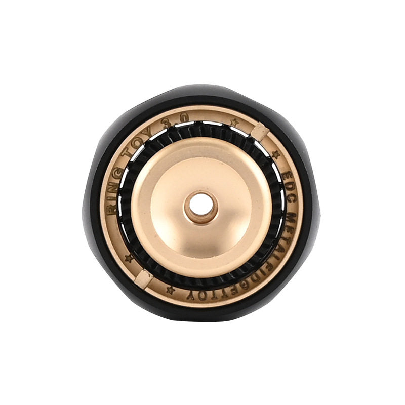 Black-and-gold-tone fingerprint fidget ring on a white background