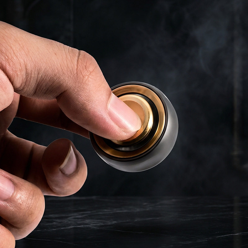 Fingerprint fidget ring shown spinning between fingers