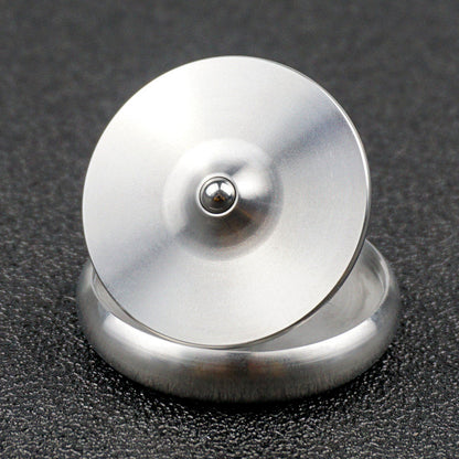 Water-drop spinning top viewed from above on its base