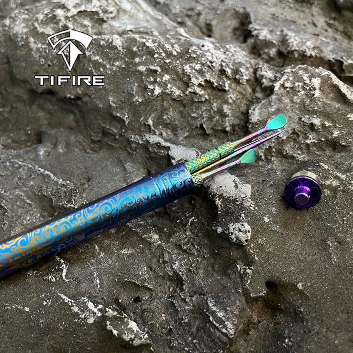 Patterned Titanium Toothpick & Ear Pick: patterned case with ear pick resting on stone (gallery view 01).