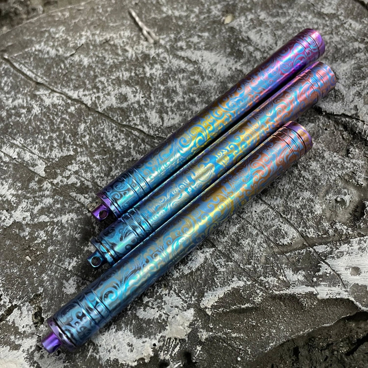 Patterned Titanium Toothpick & Ear Pick: three patterned cylindrical storage cases (gallery view 04).