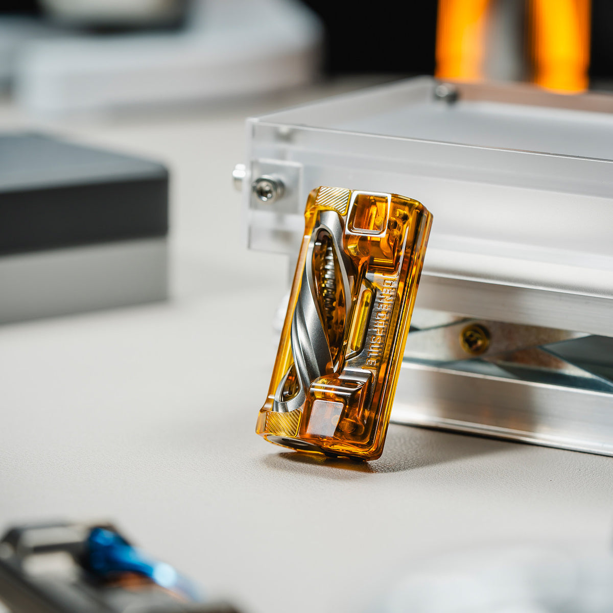 01EDC Gene Capsule Mechanical Fidget Slider with a Linked Double-Helix Display — Amber Orange — PEI and Steel