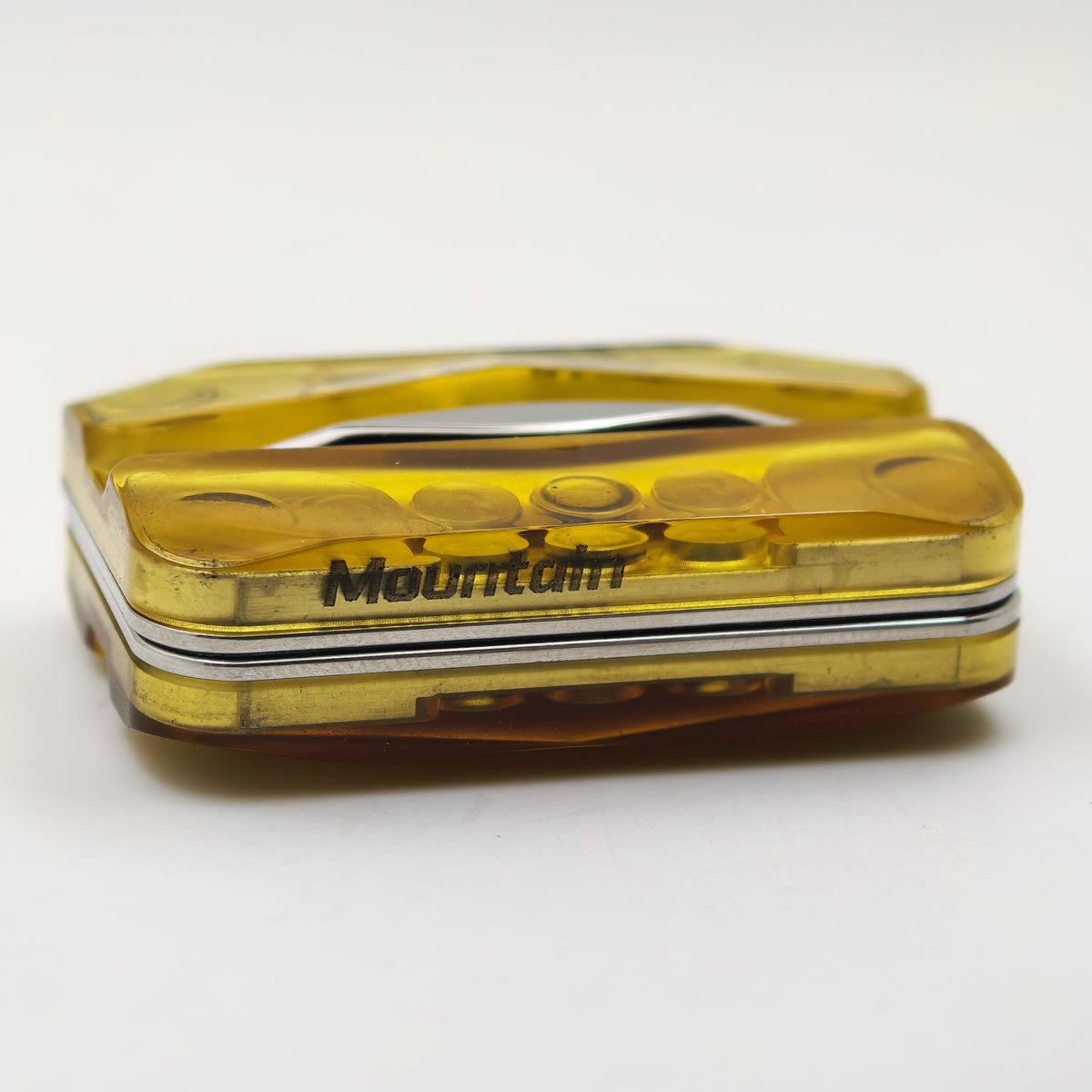 The amber PEI Empty Mountain slider in its closed, layered position