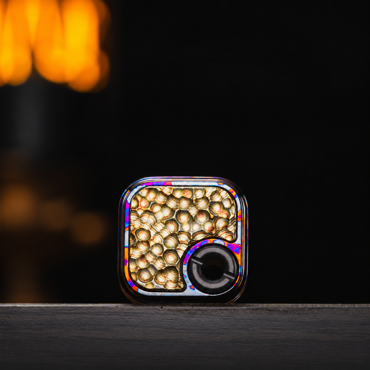 The patterned zirconium-titanium Toast Mini body with a hammered brass inlay